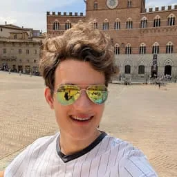 A young male with a colorful background