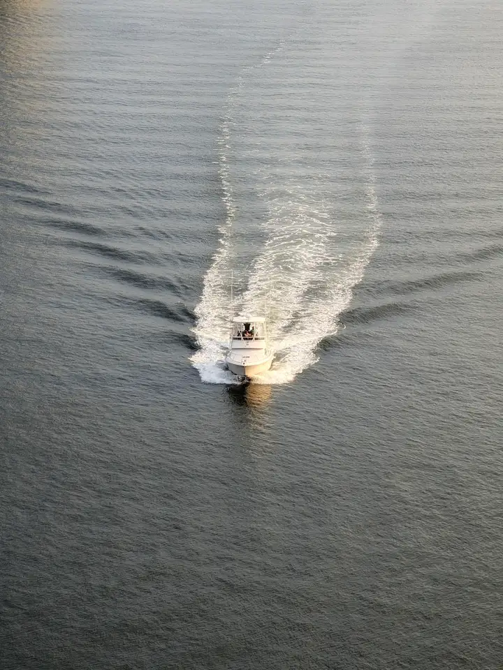 A boat in the center of the image in the east river